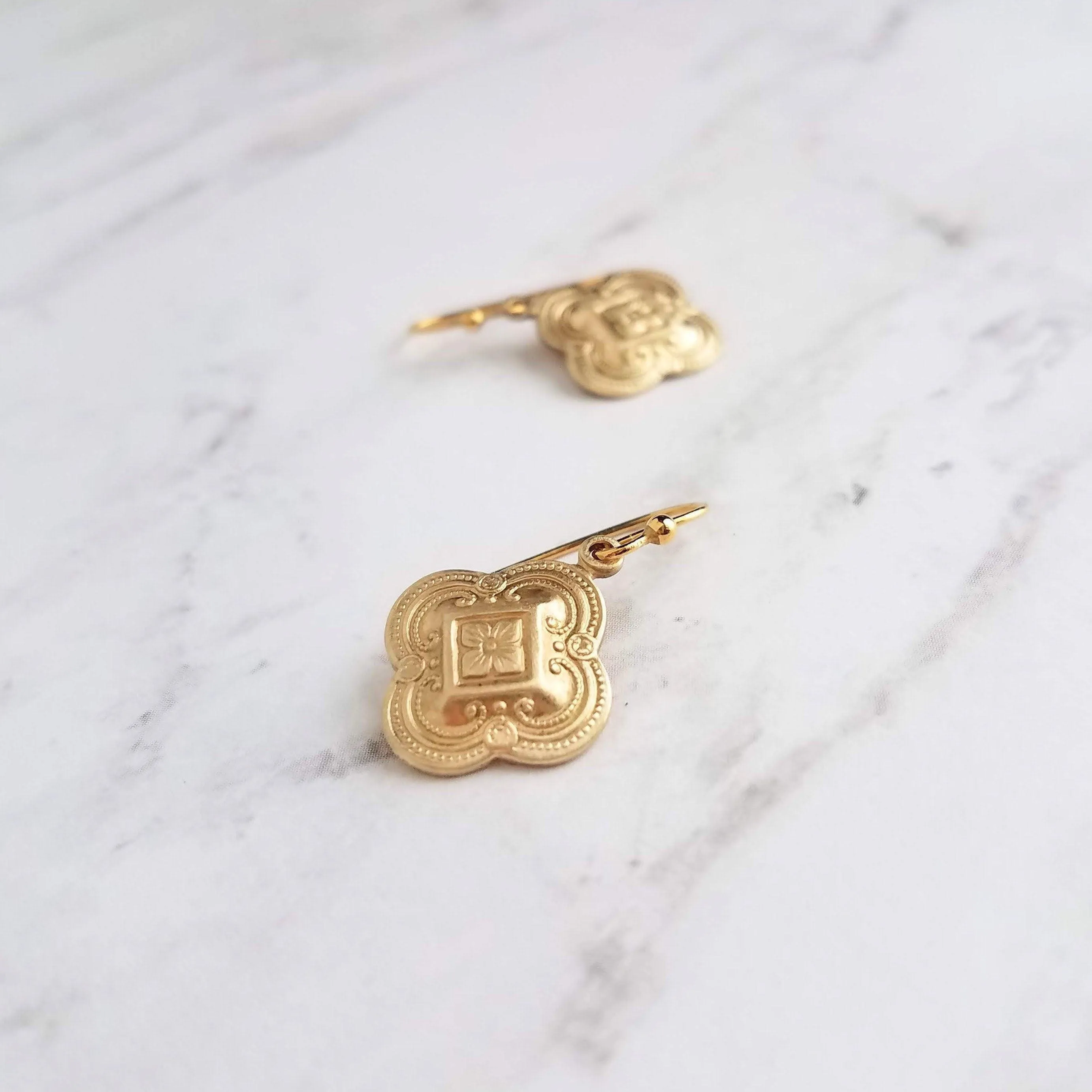 Clover Earring - sweet little gold stamped 4 leaf/lobe Irish charm on small plain ear hook - raised design w/ boho ornate detail
